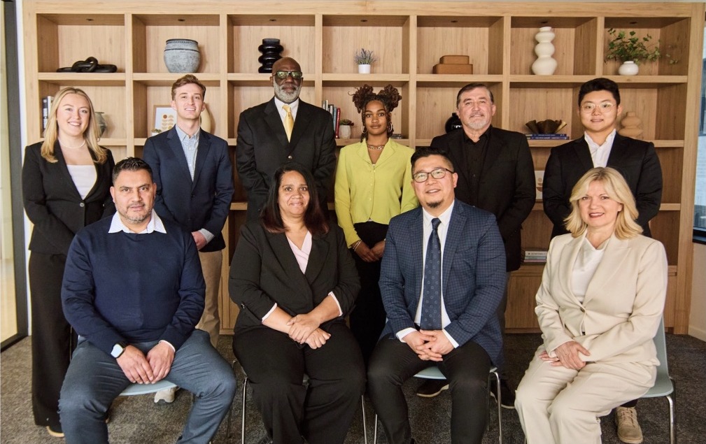 The Taicoon Property Partners team gathered together in their Washington, D.C. office