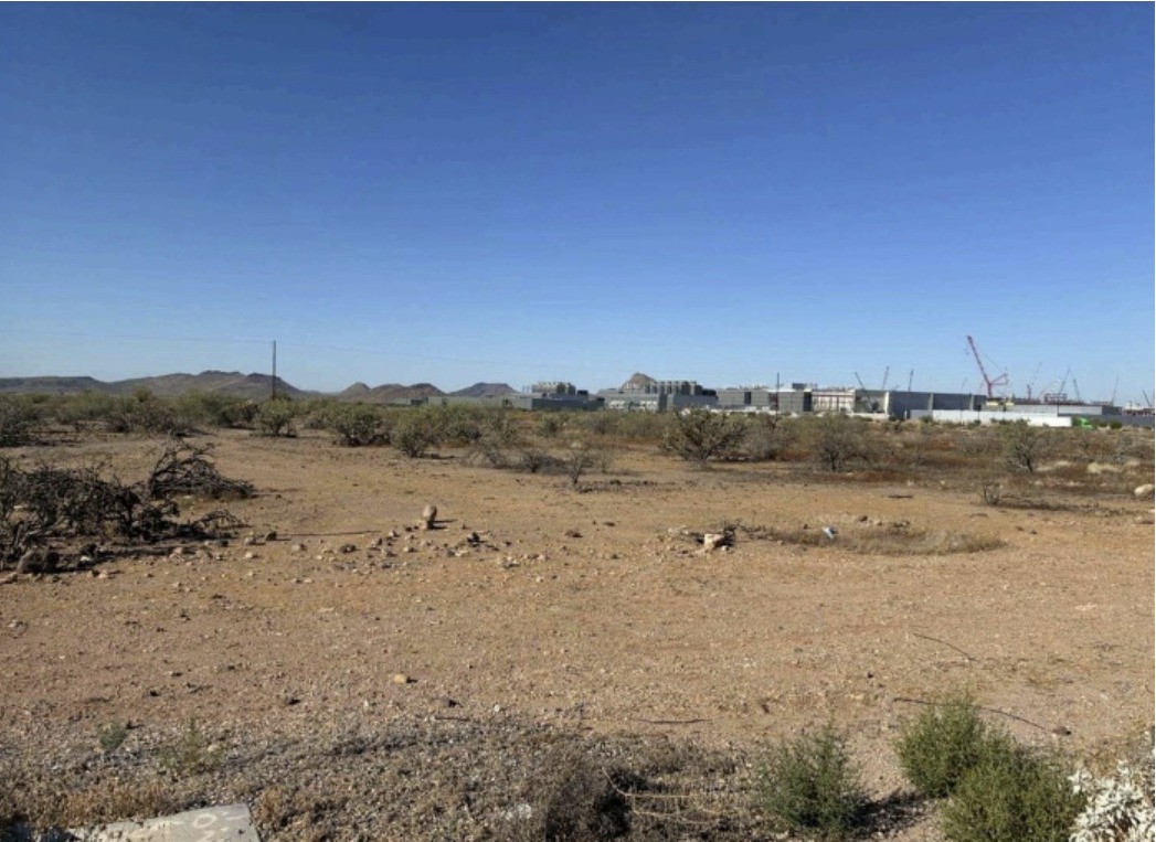 Vacant north Phoenix desert land with TSMC chipmaking plant construction in the distance